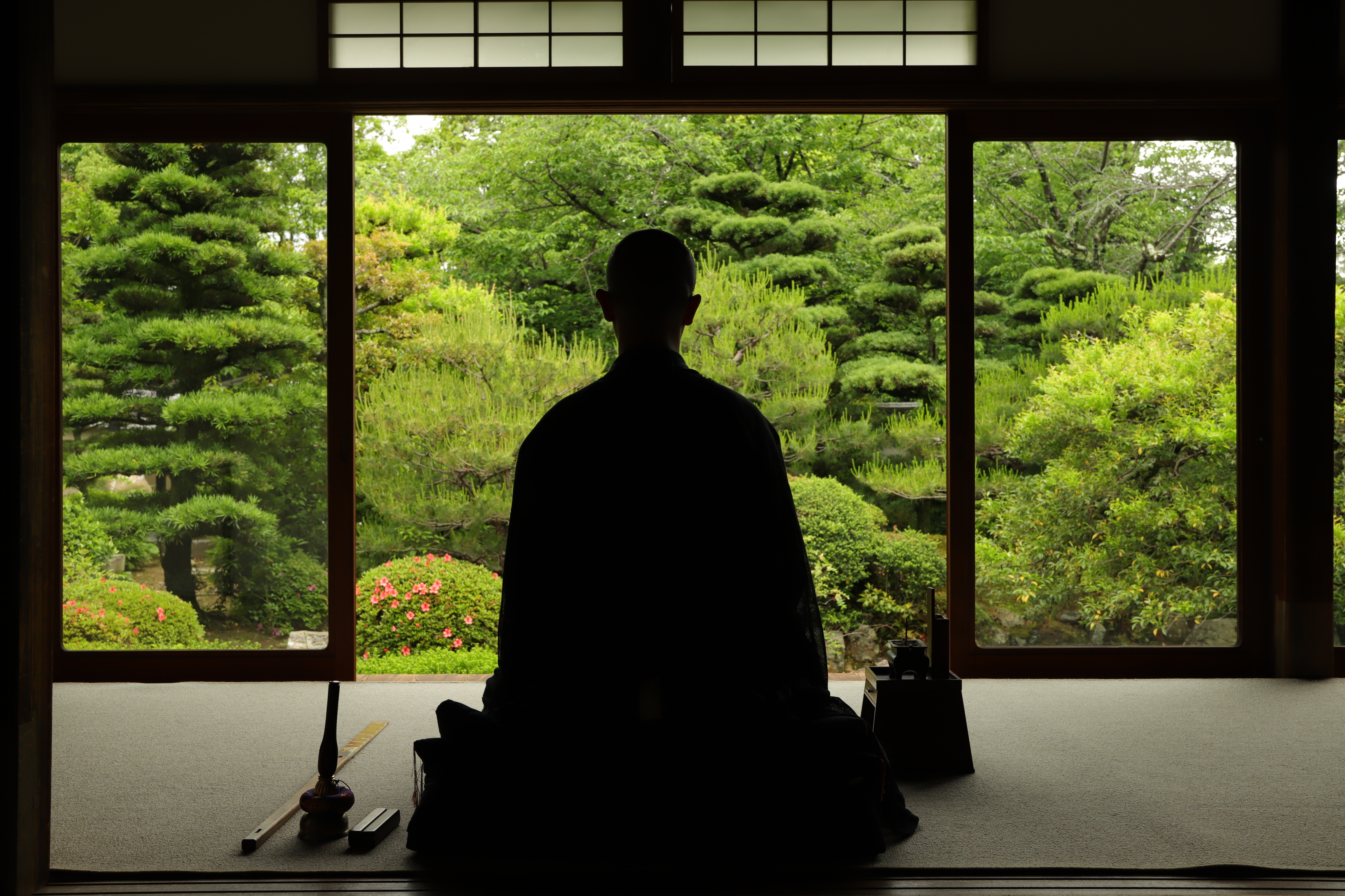 Zen monk in meditation facing garden at Jushoin Temple, Kyoto