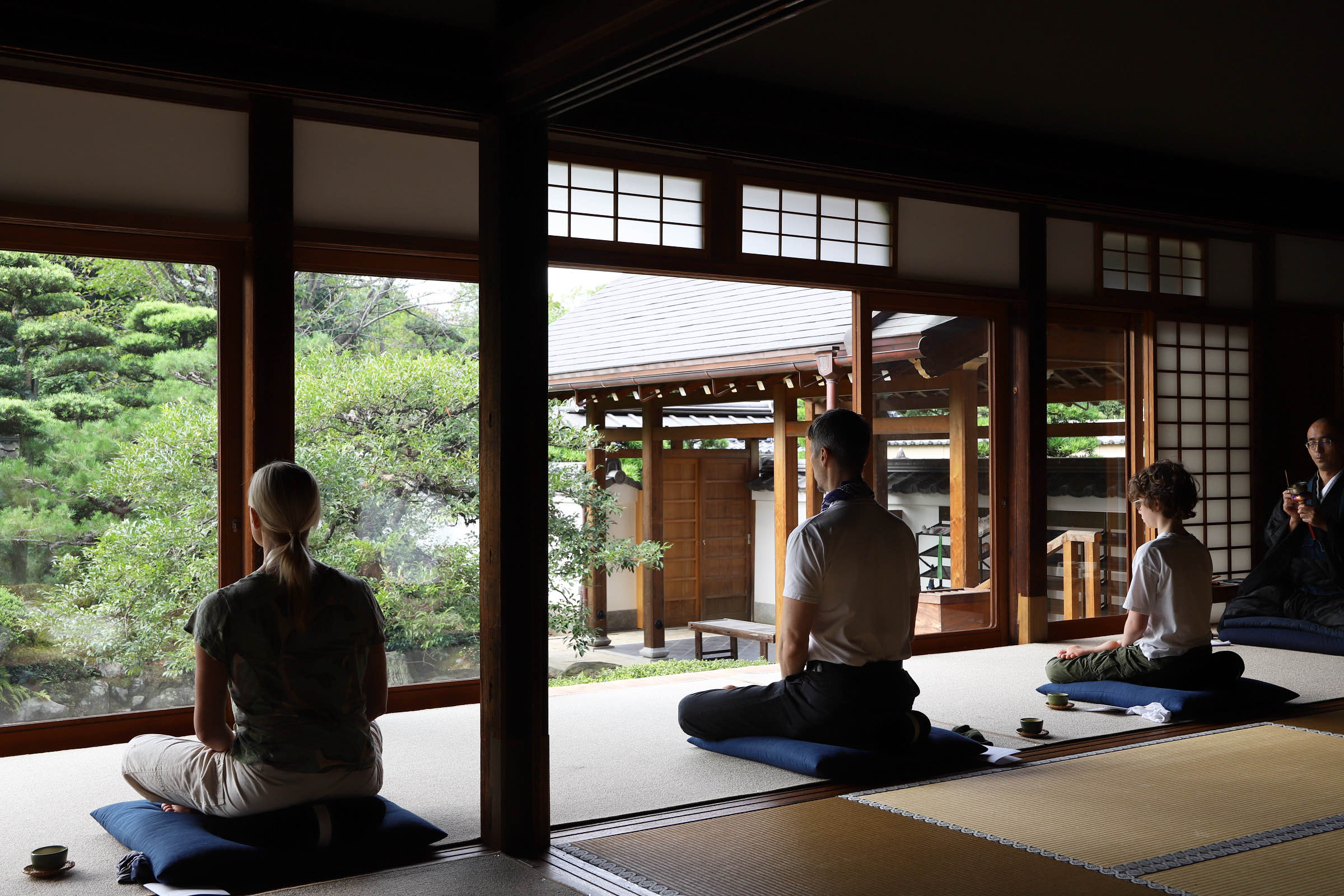 Overseas visitors practicing zazen at a Kyoto temple